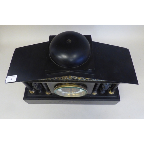 8 - An early 20thC black slate cased mantel clock of architectural form, depicting a Roman battle scene ... 