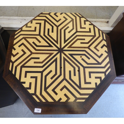 A modern plinth of two tier hexagonal forms with an abstract pattern ...