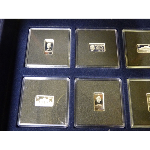 38 - A group of sixteen miniature, silver coloured metal, individually themed ingots