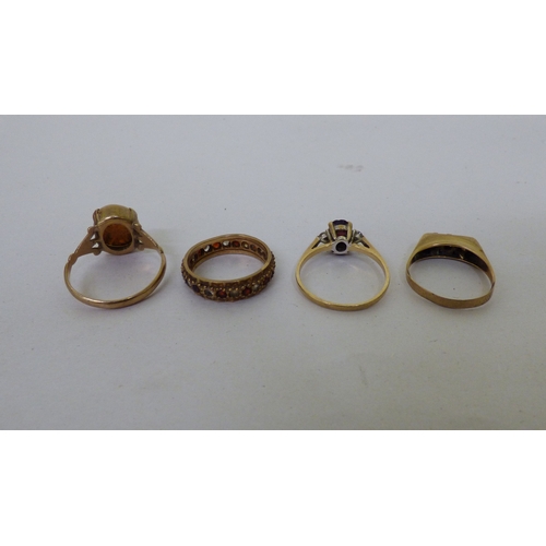 Four 9ct gold variously set rings (approx. combined gross weight 10.2grms)
