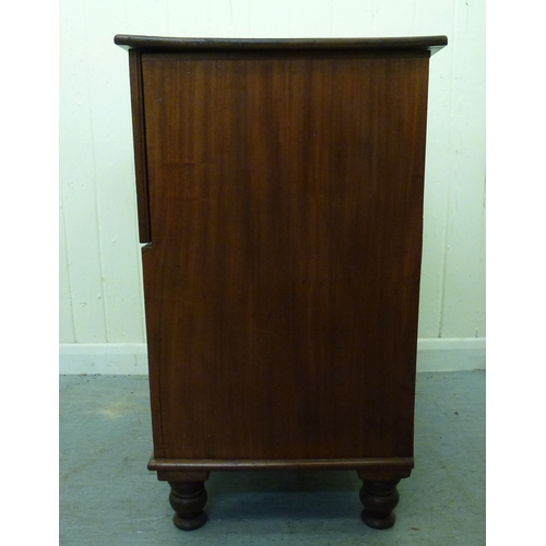 50 - A 19thC mahogany commode chest with a hinged lid and four facsimile front drawers, raised on a plint... 