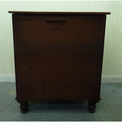 50 - A 19thC mahogany commode chest with a hinged lid and four facsimile front drawers, raised on a plint... 