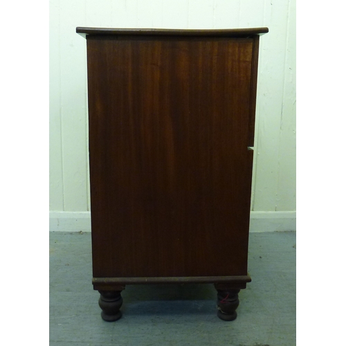 50 - A 19thC mahogany commode chest with a hinged lid and four facsimile front drawers, raised on a plint... 