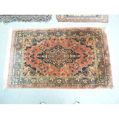 1 - Three rugs: to include a Persian style example, decorated with a central medallion and floral border... 