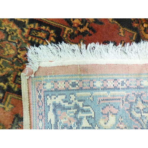 1 - Three rugs: to include a Persian style example, decorated with a central medallion and floral border... 