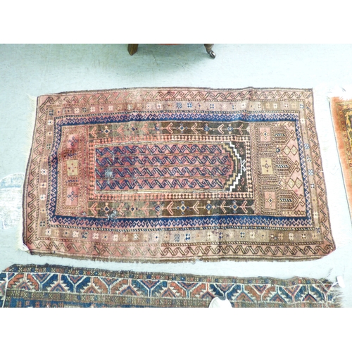 1 - Three rugs: to include a Persian style example, decorated with a central medallion and floral border... 