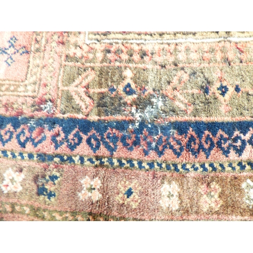 1 - Three rugs: to include a Persian style example, decorated with a central medallion and floral border... 