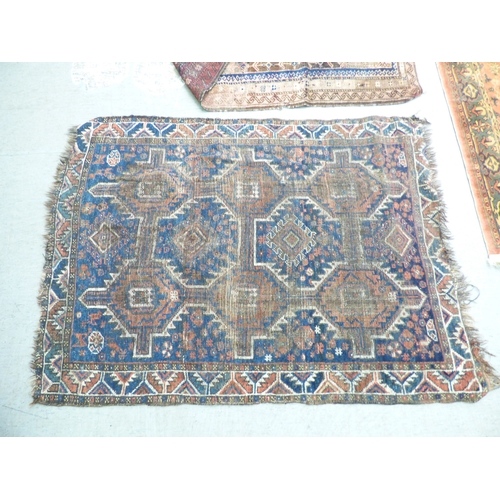 1 - Three rugs: to include a Persian style example, decorated with a central medallion and floral border... 