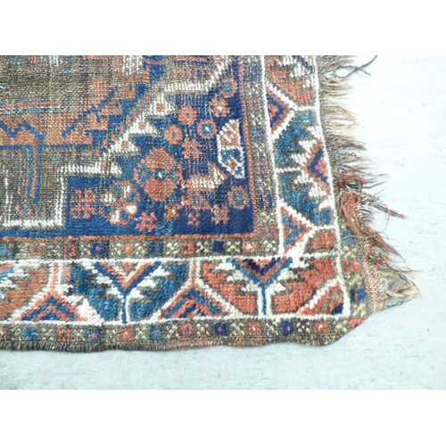 1 - Three rugs: to include a Persian style example, decorated with a central medallion and floral border... 