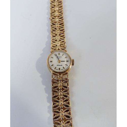 16 - A lady's Rotary 9ct gold cased, manual bracelet wristwatch, faced by a baton dial  (approx. 23.1grms... 