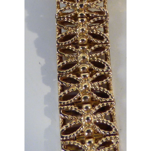 16 - A lady's Rotary 9ct gold cased, manual bracelet wristwatch, faced by a baton dial  (approx. 23.1grms... 