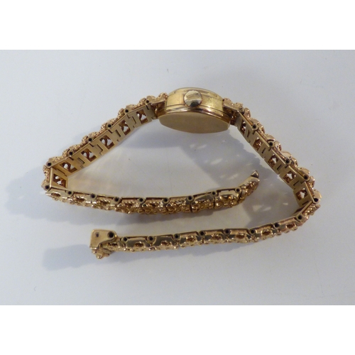 16 - A lady's Rotary 9ct gold cased, manual bracelet wristwatch, faced by a baton dial  (approx. 23.1grms... 