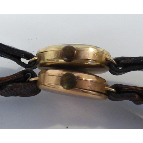 17 - Two early 20thC 9ct gold cased manual wristwatches, each faced by an Arabic dial, on leather straps