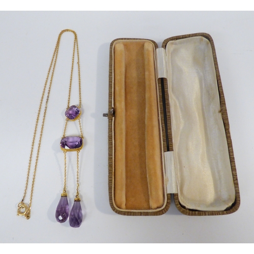18 - A 9ct gold pendant necklace, set with variously cut amethyst