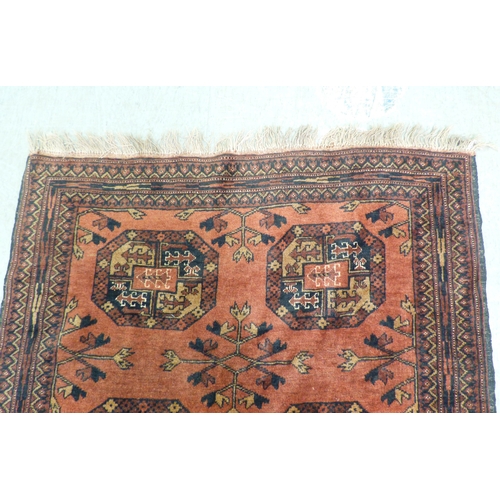 2 - A Turkish Esari style rug, decorated with six elephant foot guls and floral motif, on a red ground&n... 