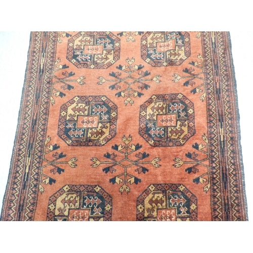 2 - A Turkish Esari style rug, decorated with six elephant foot guls and floral motif, on a red ground&n... 