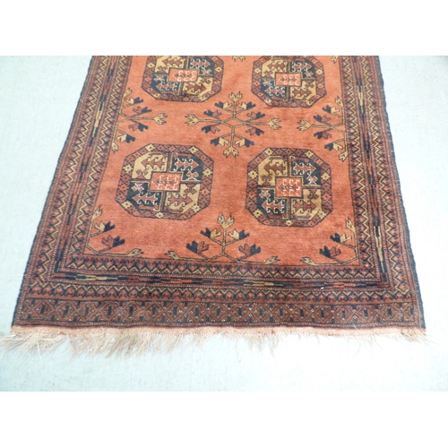 2 - A Turkish Esari style rug, decorated with six elephant foot guls and floral motif, on a red ground&n... 