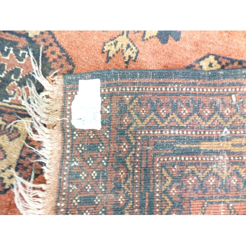 2 - A Turkish Esari style rug, decorated with six elephant foot guls and floral motif, on a red ground&n... 