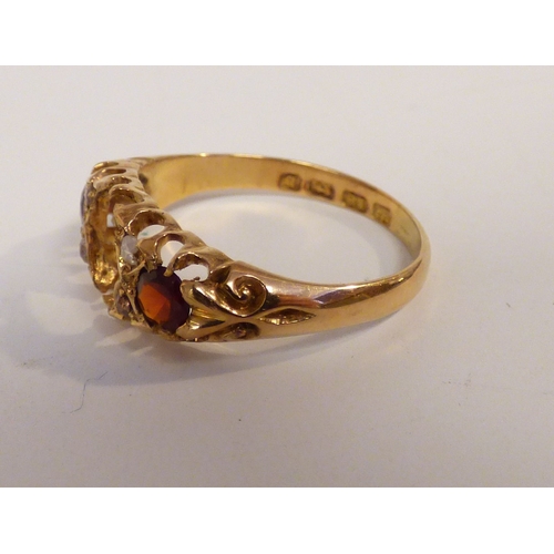 20 - An 18ct gold, ruby and diamond ring (centre stone missing)&nbsp; (approx. 3.6grms)