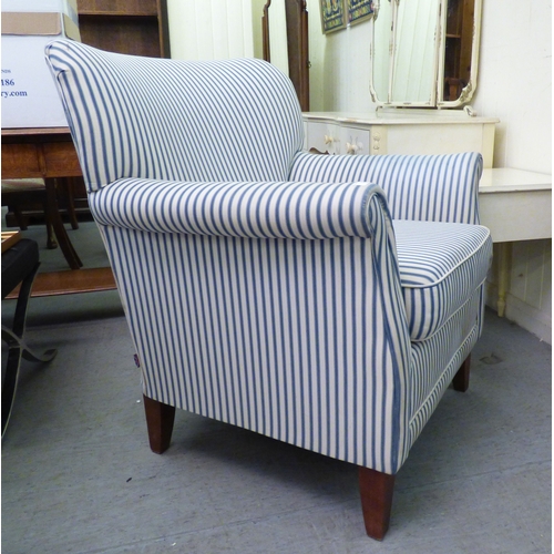 3 - A modern Marks & Spencer bedroom chair, upholstered in stripe fabric, raised on tapered legs