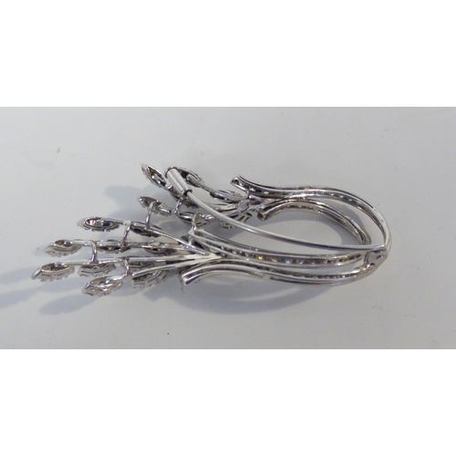 31 - A white metal diamond set, floral spray brooch&nbsp; (approx. 12.5grms)