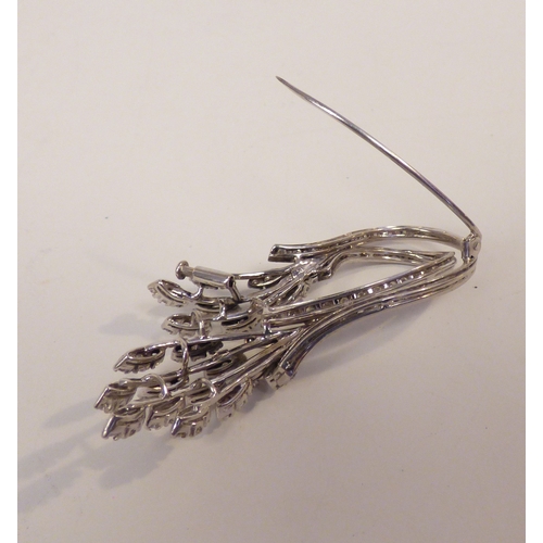 31 - A white metal diamond set, floral spray brooch&nbsp; (approx. 12.5grms)