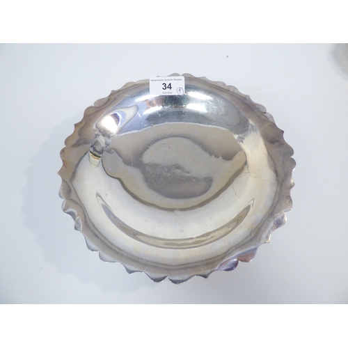 34 - A set of four silver dishes, each with a cut wavy edge, on a pedestal foot&nbsp; London 1905&nbsp; 5... 