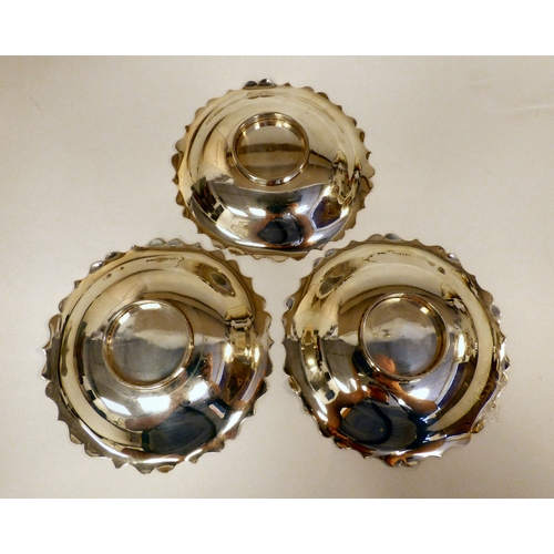 34 - A set of four silver dishes, each with a cut wavy edge, on a pedestal foot&nbsp; London 1905&nbsp; 5... 