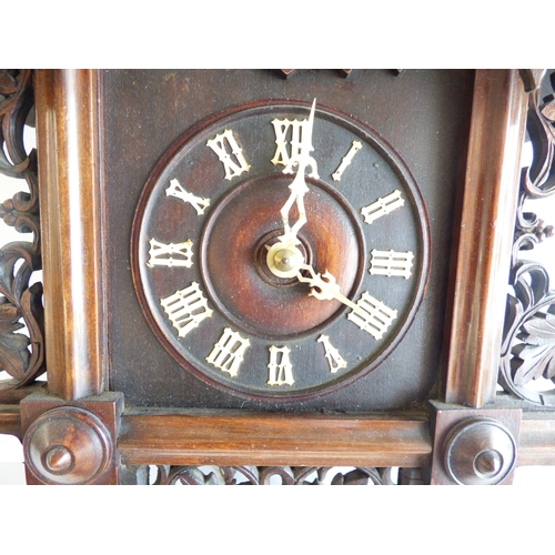 39 - A 20thC stained beech and carved softwood cuckoo clock&nbsp; 15