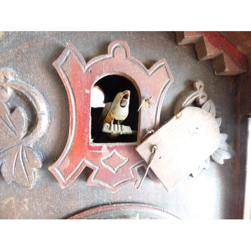 39 - A 20thC stained beech and carved softwood cuckoo clock&nbsp; 15