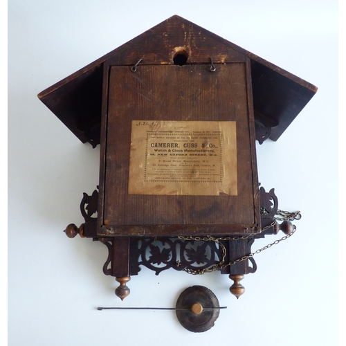 39 - A 20thC stained beech and carved softwood cuckoo clock&nbsp; 15