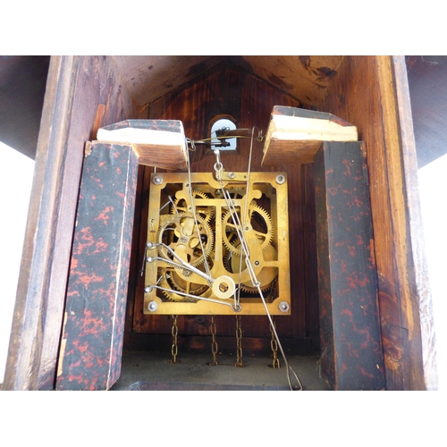 39 - A 20thC stained beech and carved softwood cuckoo clock&nbsp; 15