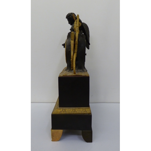 4 - An early 20thC (probably) French bronze and gilt metal cased mantel clock, surmounted by an angelic ... 