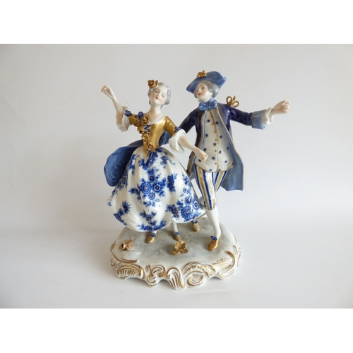 41 - Decorative ceramics: to include a Naples porcelain group, a Roman soldier, assisting a lady  9