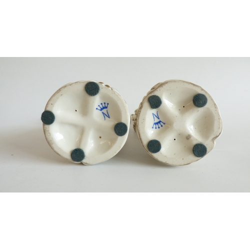 41 - Decorative ceramics: to include a Naples porcelain group, a Roman soldier, assisting a lady  9