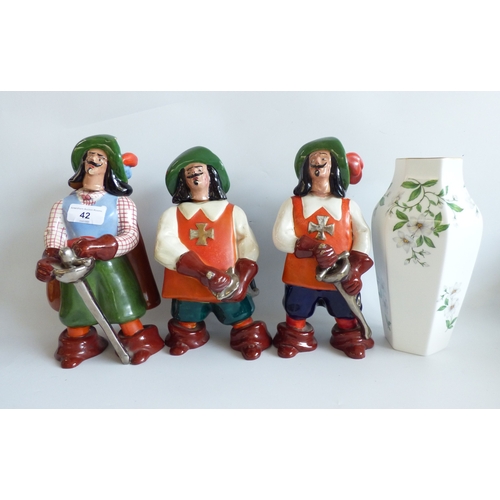 42 - Decorative items: to include a trio of Torino pottery decanters; and a bronzed finished mouse  4