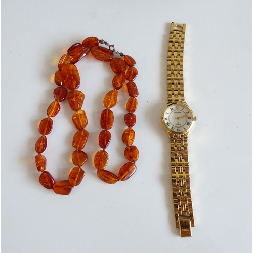 46 - Items of personal ornament: to include a lady's gold plated, stainless steel cased and strapped wris... 