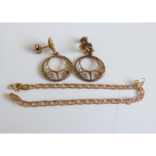 46 - Items of personal ornament: to include a lady's gold plated, stainless steel cased and strapped wris... 