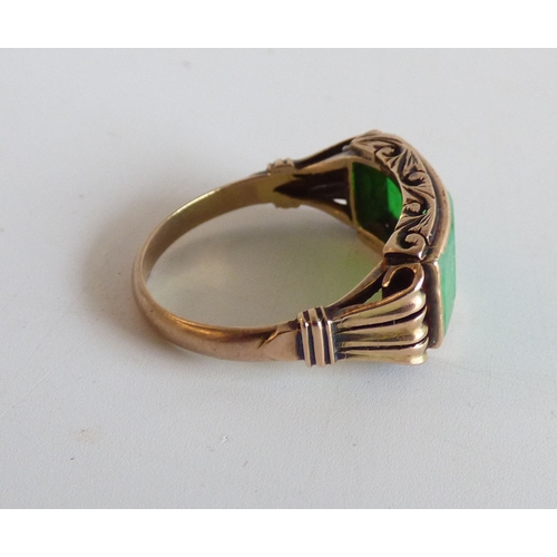 48 - A Chinese style yellow metal ring, set with four jade coloured stone tablets  stamped 14k  (approx. ... 