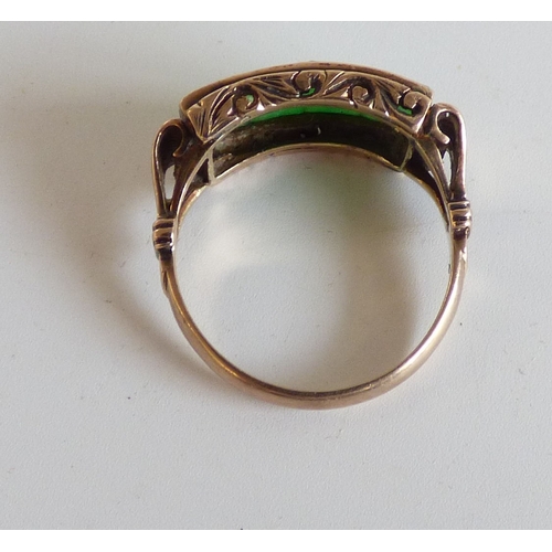 48 - A Chinese style yellow metal ring, set with four jade coloured stone tablets  stamped 14k  (approx. ... 