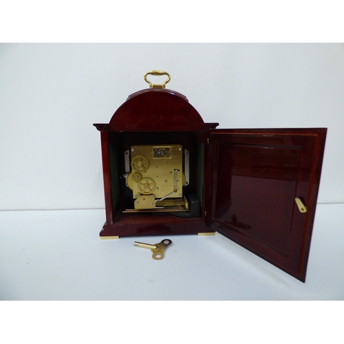 5 - Three variously cased and aged mantel clocks: to include an early 20thC black slate and marble examp... 