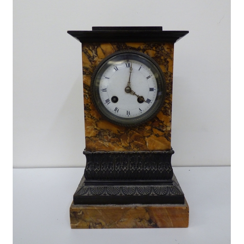 5 - Three variously cased and aged mantel clocks: to include an early 20thC black slate and marble examp... 