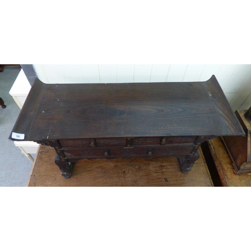 58 - A 20thC Korean style fruitwood table top, altar style, three drawer cabinet, raised on carved feet  ... 