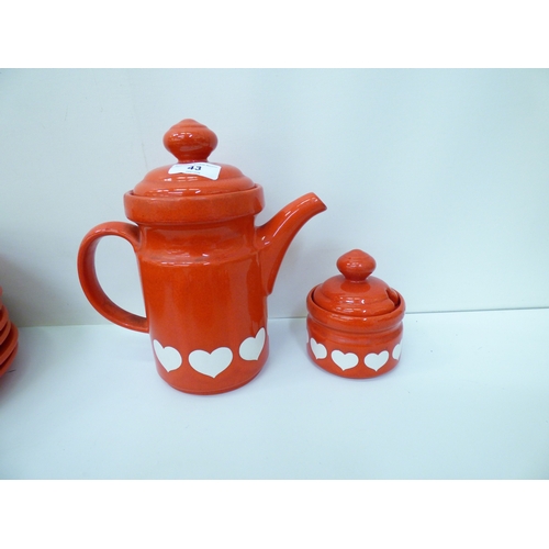 43 - Waechtersbach, W. Germany pottery tableware, decorated with white hearts, on a red ground