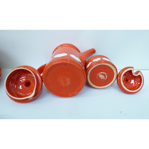 43 - Waechtersbach, W. Germany pottery tableware, decorated with white hearts, on a red ground