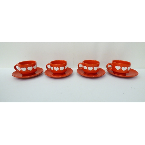 43 - Waechtersbach, W. Germany pottery tableware, decorated with white hearts, on a red ground