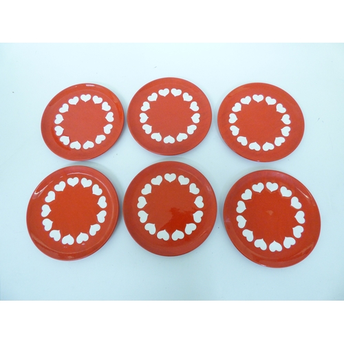 43 - Waechtersbach, W. Germany pottery tableware, decorated with white hearts, on a red ground