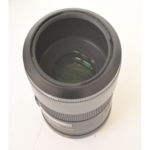 Photographic equipment, viz. a Sony Alpha A65 DSLR camera with a Sigma ...