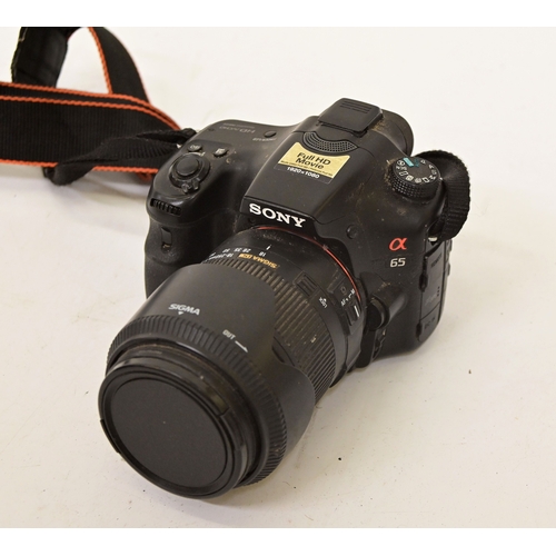 Photographic equipment, viz. a Sony Alpha A65 DSLR camera with a Sigma ...