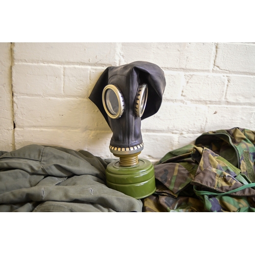 Military uniforms: to include a field axe/shovel(Please Note: this lot ...